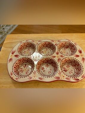Temp-tations Old World 6-cup muffin pan with hand-painted red floral patterns.